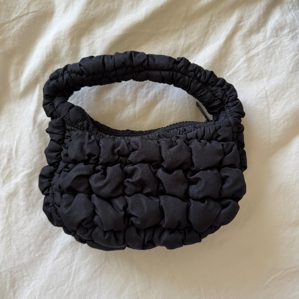 COS black quilted micro bag